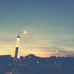 View of illuminated street light against sky