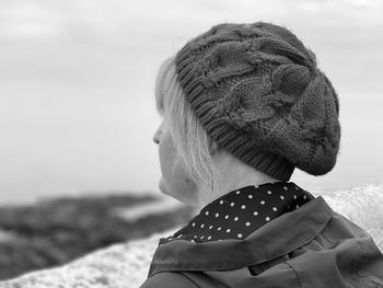 Close-up of woman looking at sea against sky