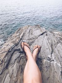 Low section of man relaxing in water