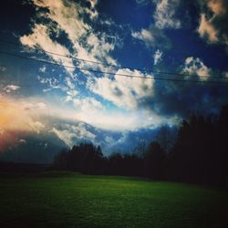 Scenic view of landscape against cloudy sky