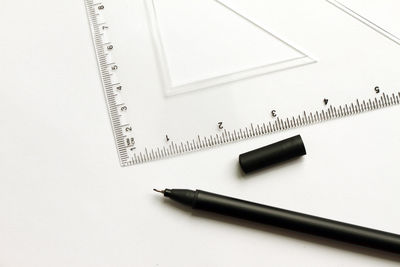 High angle view of pen on table against white background