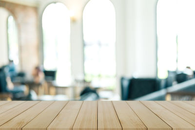 Close-up of empty wooden table in building