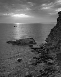Scenic view of sea against cloudy sky