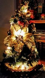 Illuminated christmas tree at night