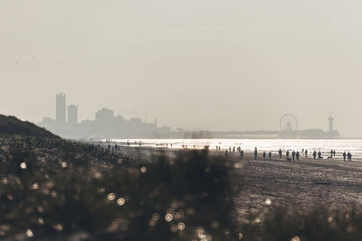 Panoramic view of river and buildings against clear sky