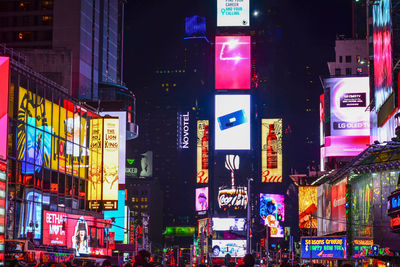 Illuminated buildings at night in city