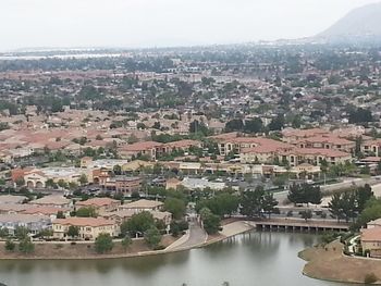 High angle view of river amidst buildings in city