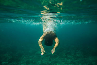 Woman swimming in sea