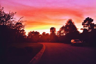 Scenic view of road at sunset