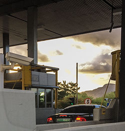 Car in city against sky during sunset