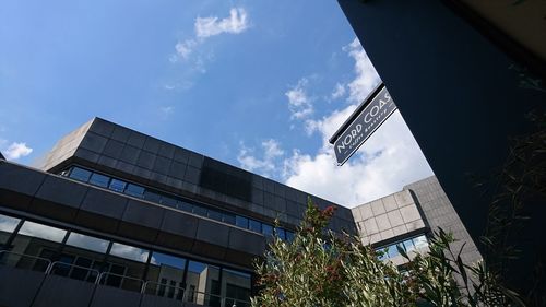 Low angle view of modern buildings against sky