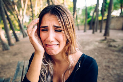 Close-up of young woman crying