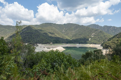 Scenic view of landscape and mountains against sky