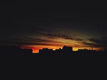 Silhouette of buildings at sunset