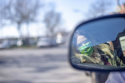 Close-up of car on side-view mirror