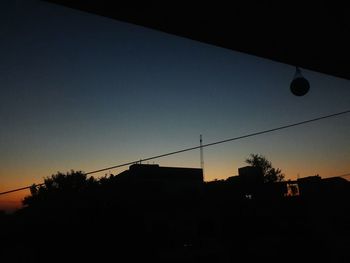 Silhouette of building at sunset