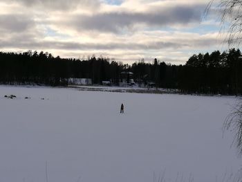 Scenic view of landscape against sky during winter
