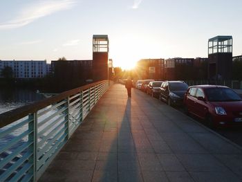 Buildings in city at sunset