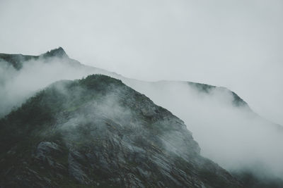 Scenic view of mountains in foggy weather
