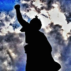 Low angle view of statue against sky