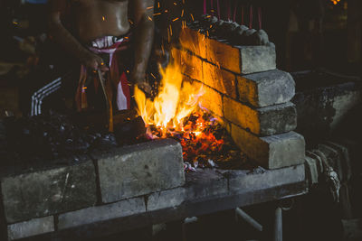 Bonfire on wooden structure at night