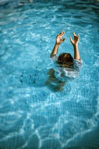 Woman swimming in pool
