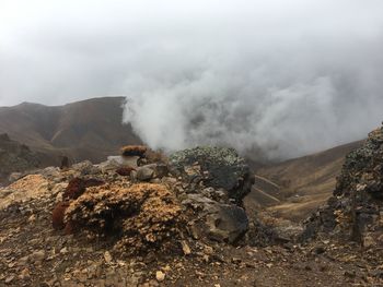 Scenic view of volcanic mountain against sky