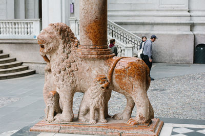 Statue of man outside building