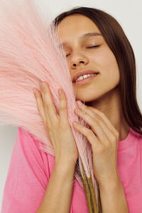 Close-up of young woman with eyes closed