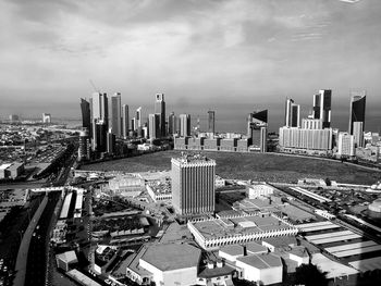 High angle view of buildings in city against sky