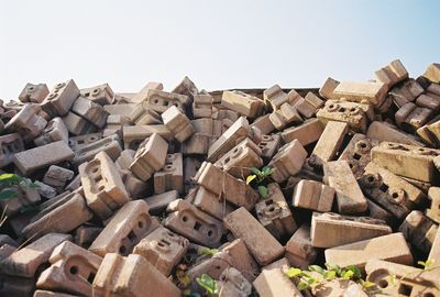 Stack of firewood against clear sky