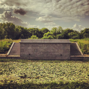 Built structure against cloudy sky