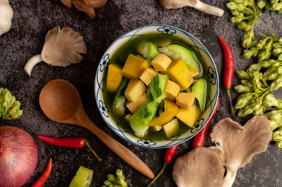 High angle view of chopped fruits in bowl on table