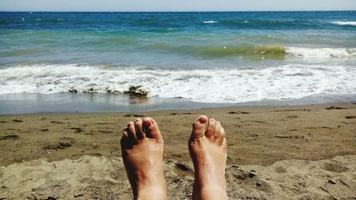 Low section of person on beach
