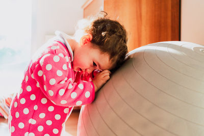 Rear view of mother sleeping girl