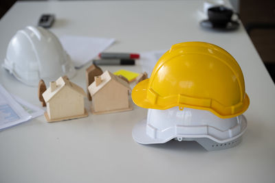 Close-up of yellow hat on table