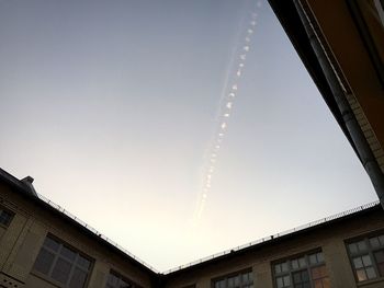 Low angle view of buildings against clear sky