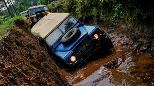 High angle view of abandoned car by river