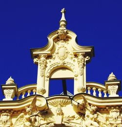 Low angle view of built structure against clear blue sky