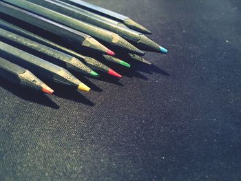 Close-up of multi colored pencils on table