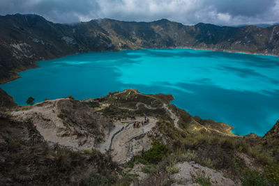 Scenic view of mountain against cloudy sky