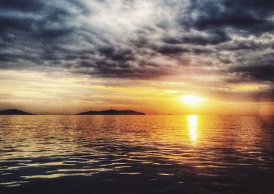 Scenic view of sea against sky at sunset