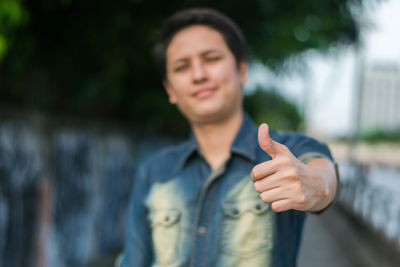 Portrait of smiling man standing outdoors