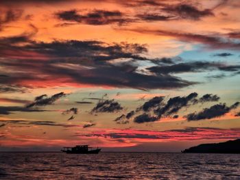 Scenic view of sea against orange sky