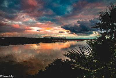 Scenic view of lake against sky during sunset
