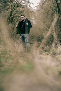 Full length of man standing on field