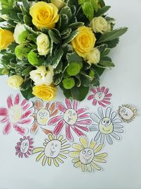 High angle view of rose bouquet on white table