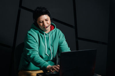 Young woman using mobile phone at home