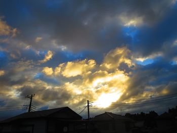 Low angle view of silhouette buildings against sky during sunset