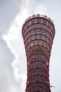 Low angle view of tower against cloudy sky